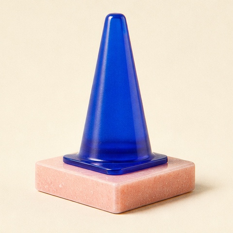 A translucent blue street marker recast as a small resin monument.
