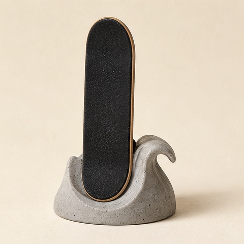 A blank black deck standing upright in a concrete wave cradle.